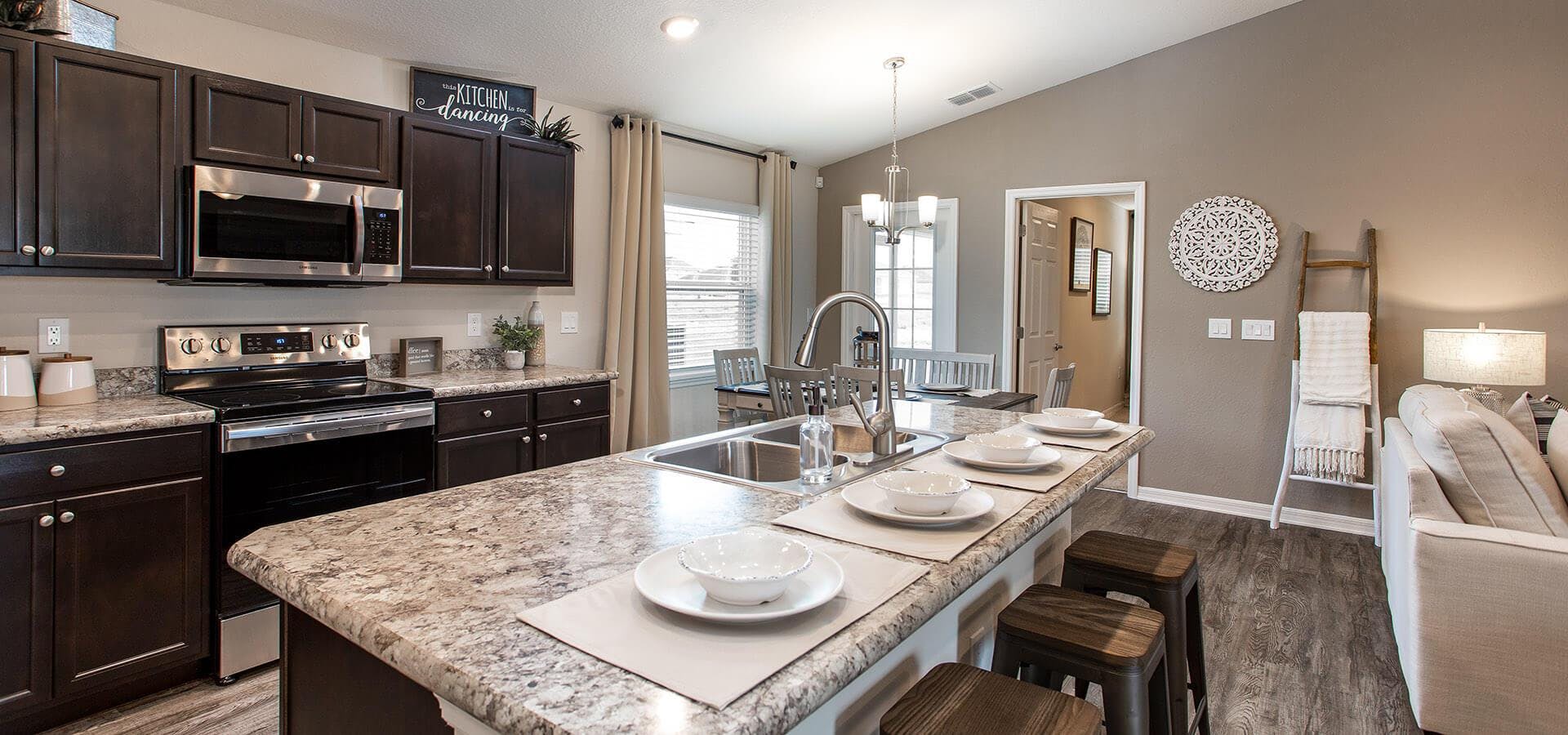 Modern eat-in kitchen with espresso cabinetry