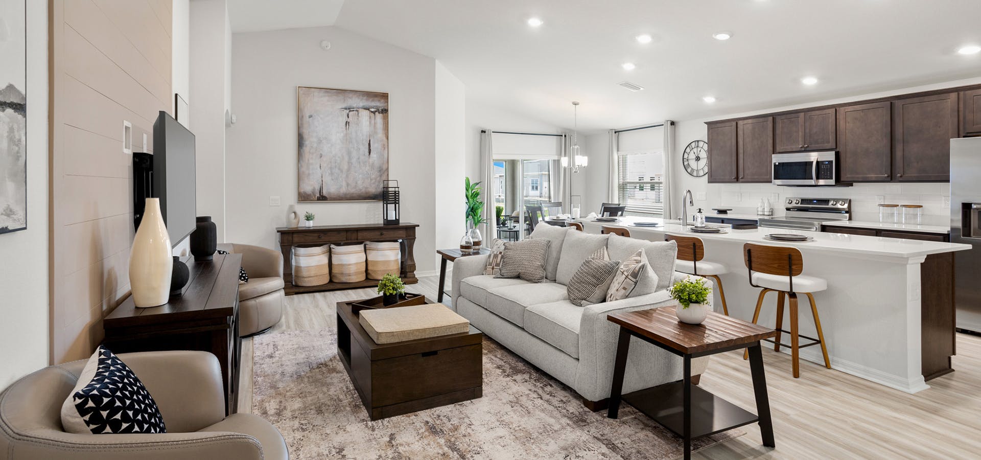 Sunny, open living area with wood finishes in the Parker by Highland Homes in St. Cloud, FL