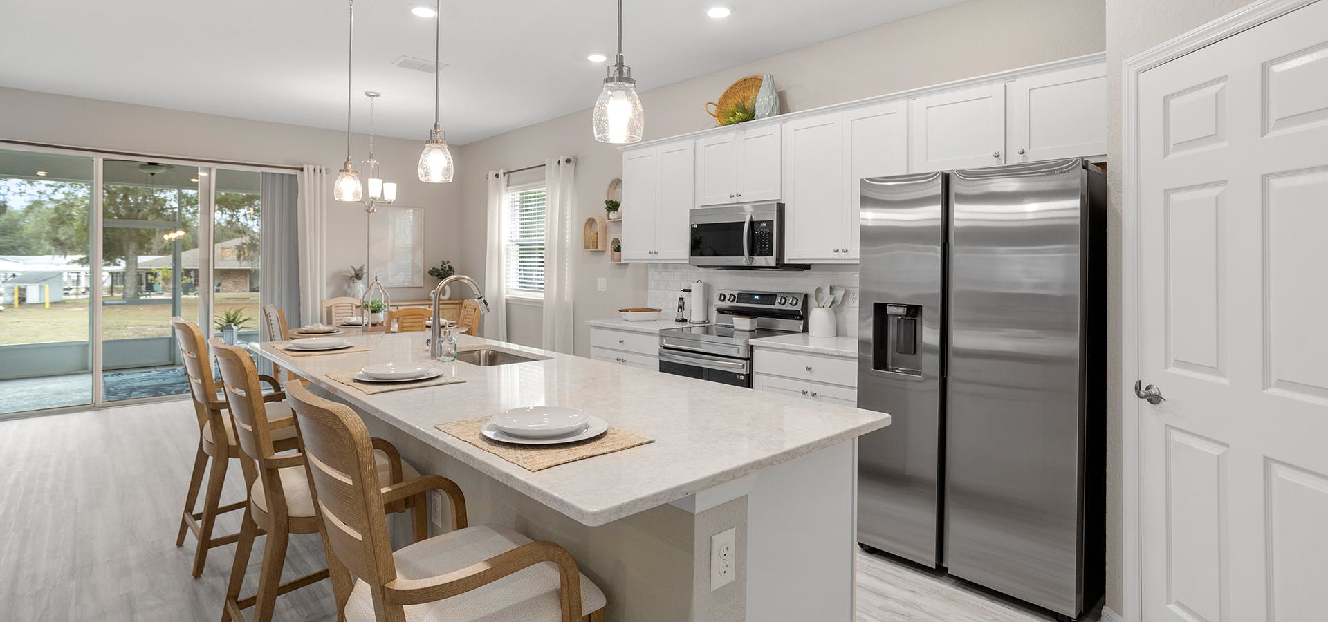 White cabinets and quartz counters in the new model home in the Falls of Ocala 55-plus community