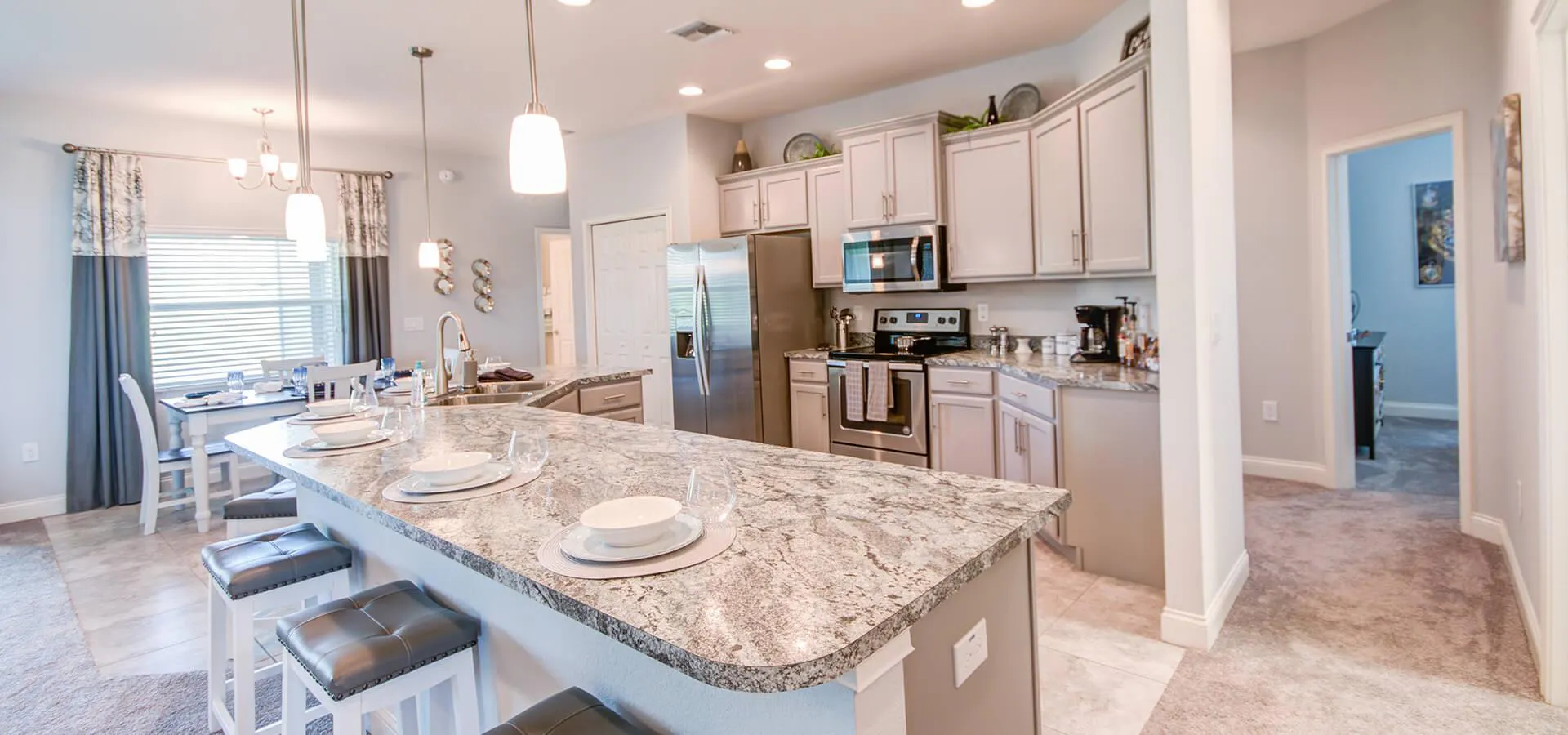 Modern kitchen with counter-height island and dining area