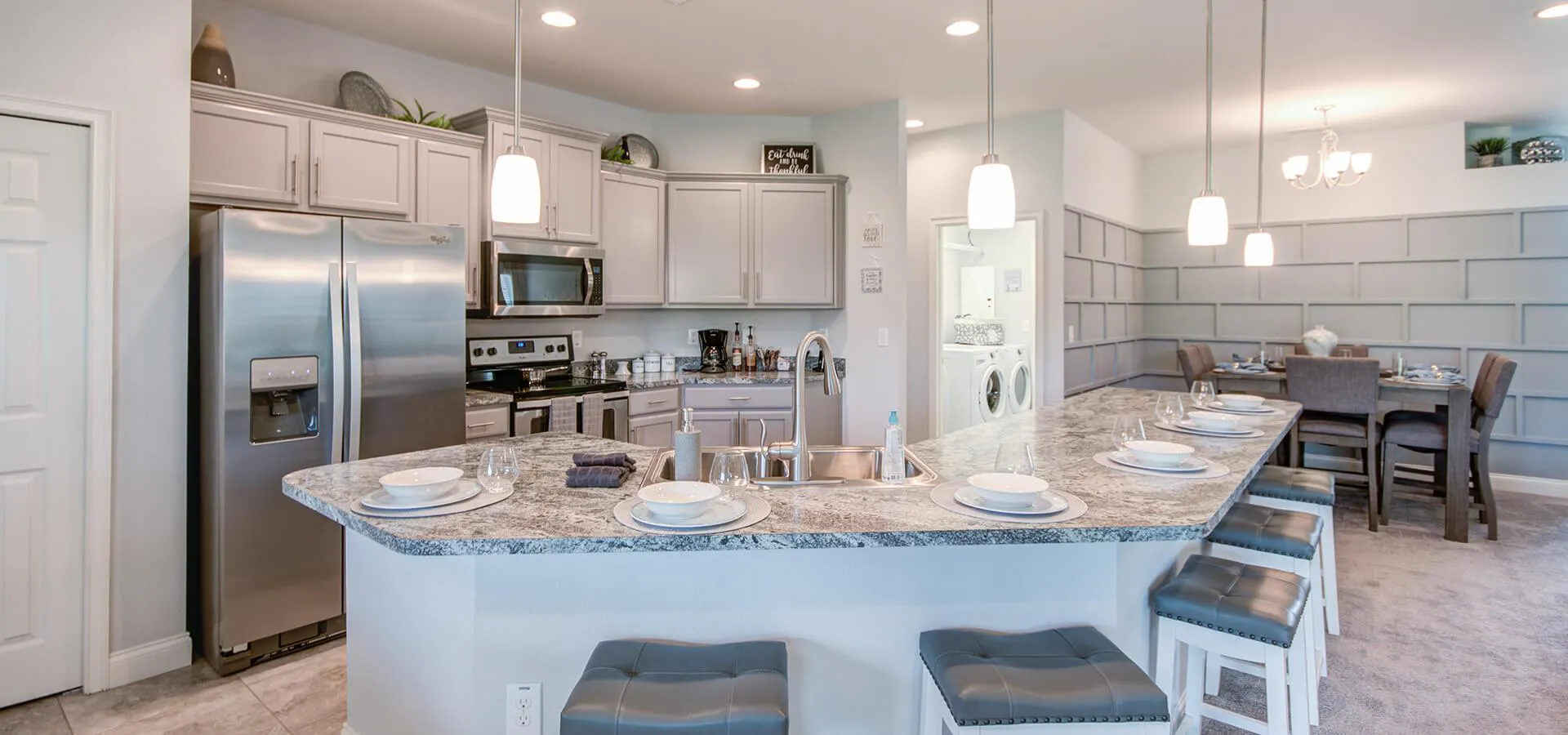 Grand kitchen island with seating available for eating