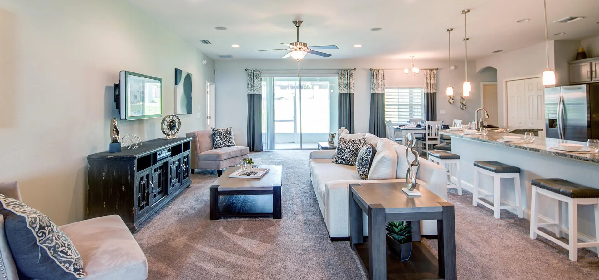 Fully-open living area including kitchen with counter-height bar