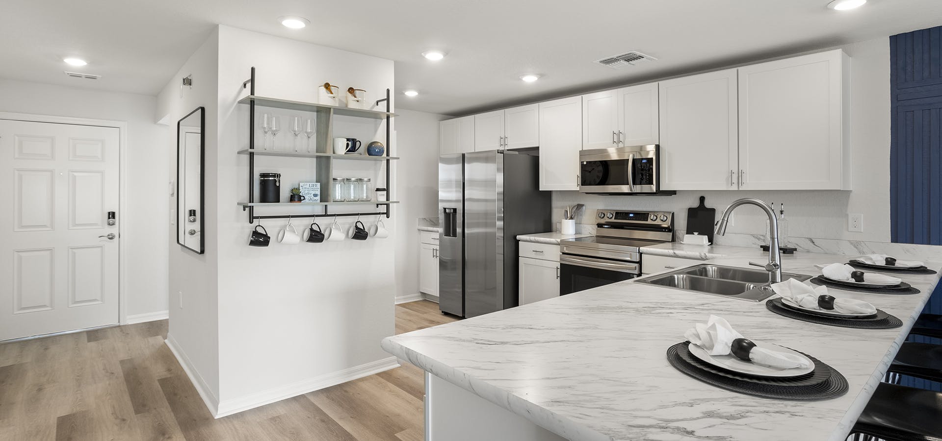 Kitchen with white cabinets in the Catalina by Highland Homes