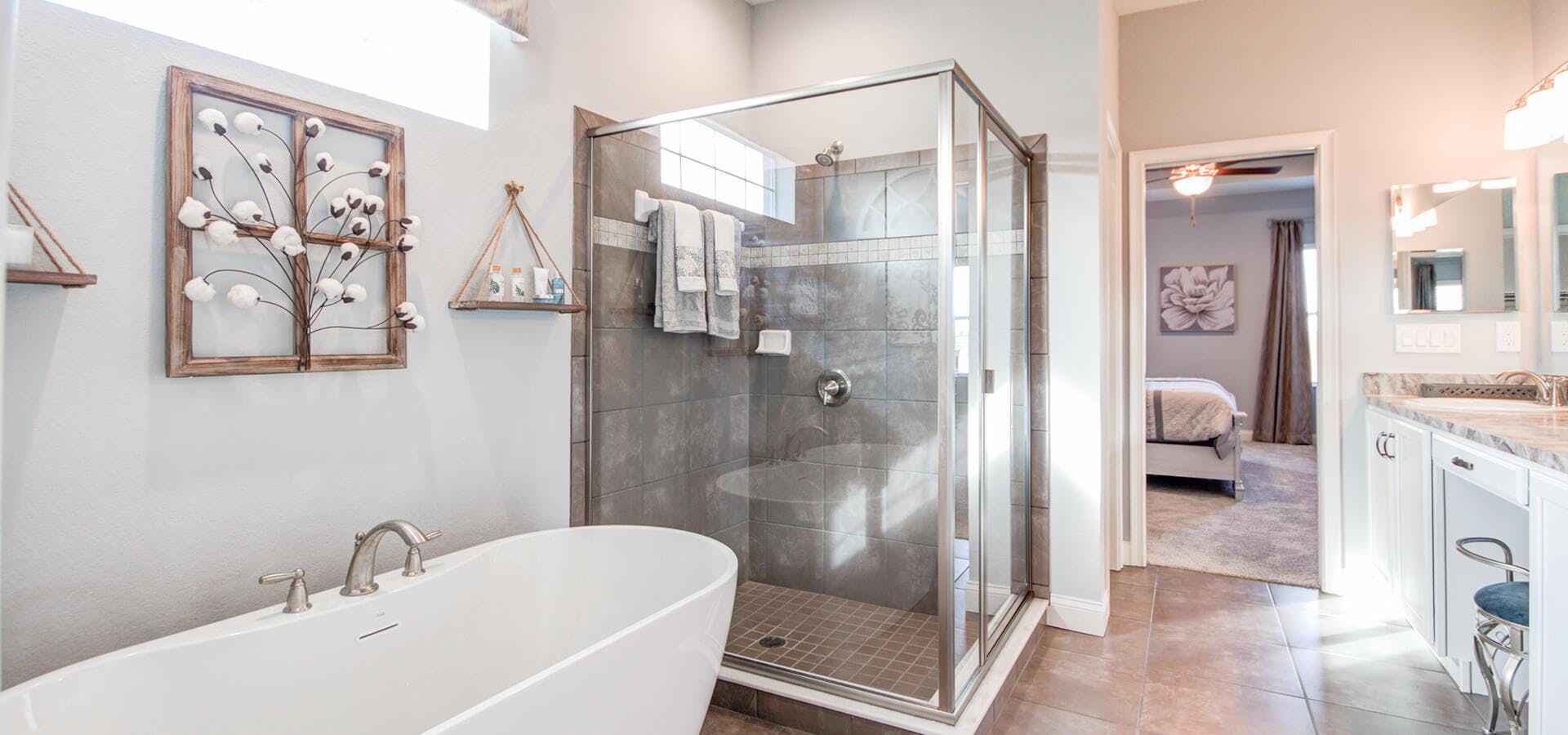 Spa bath with freestanding tub and separate tiled shower