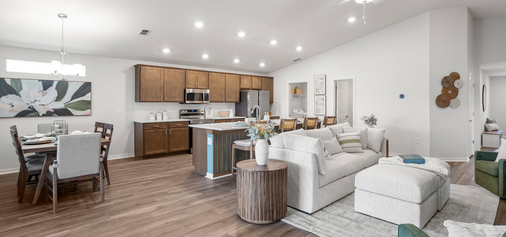 Light-filled, open living area with natural wood and light-colored furnishings