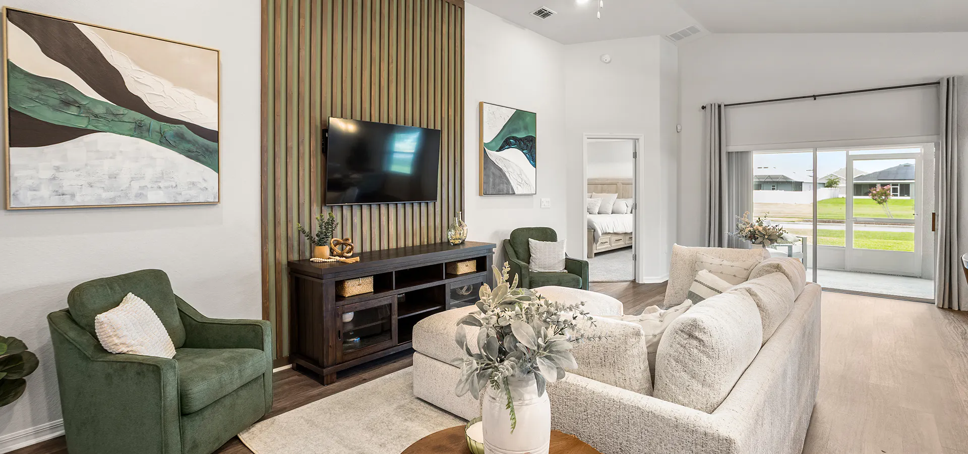 Light-filled, open living area with natural wood and light-colored furnishings