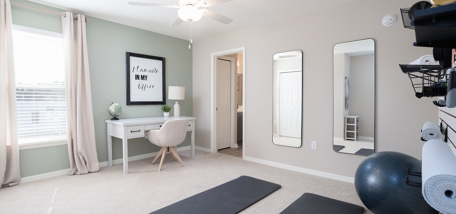 Combo yoga room and office with Namaste sign