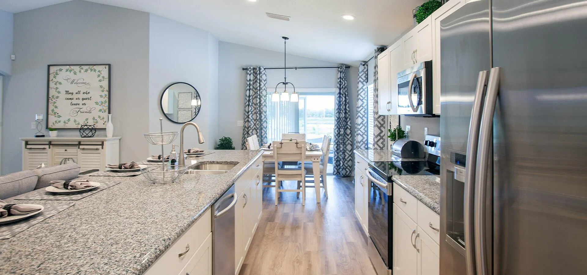 Modern kitchen adjacent to sunny dining cafe