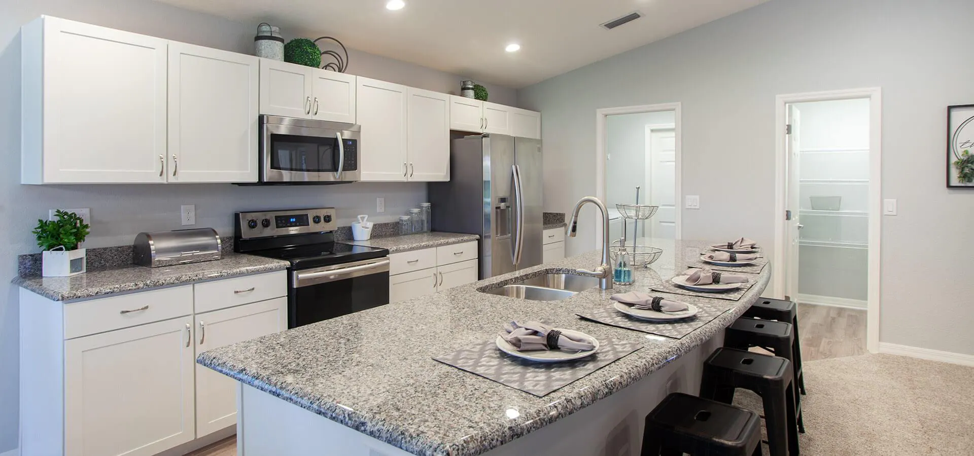 Large island in kitchen with seating available for eating in