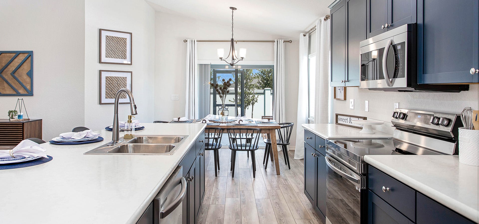 Kitchen in the Parker by Highland Homes in Wimauma, Florida