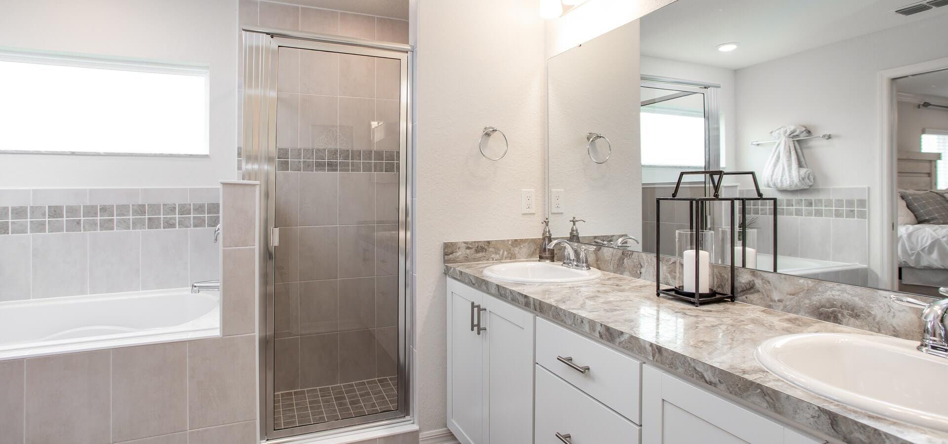 Spacious en-suite bathroom with separate tub and shower