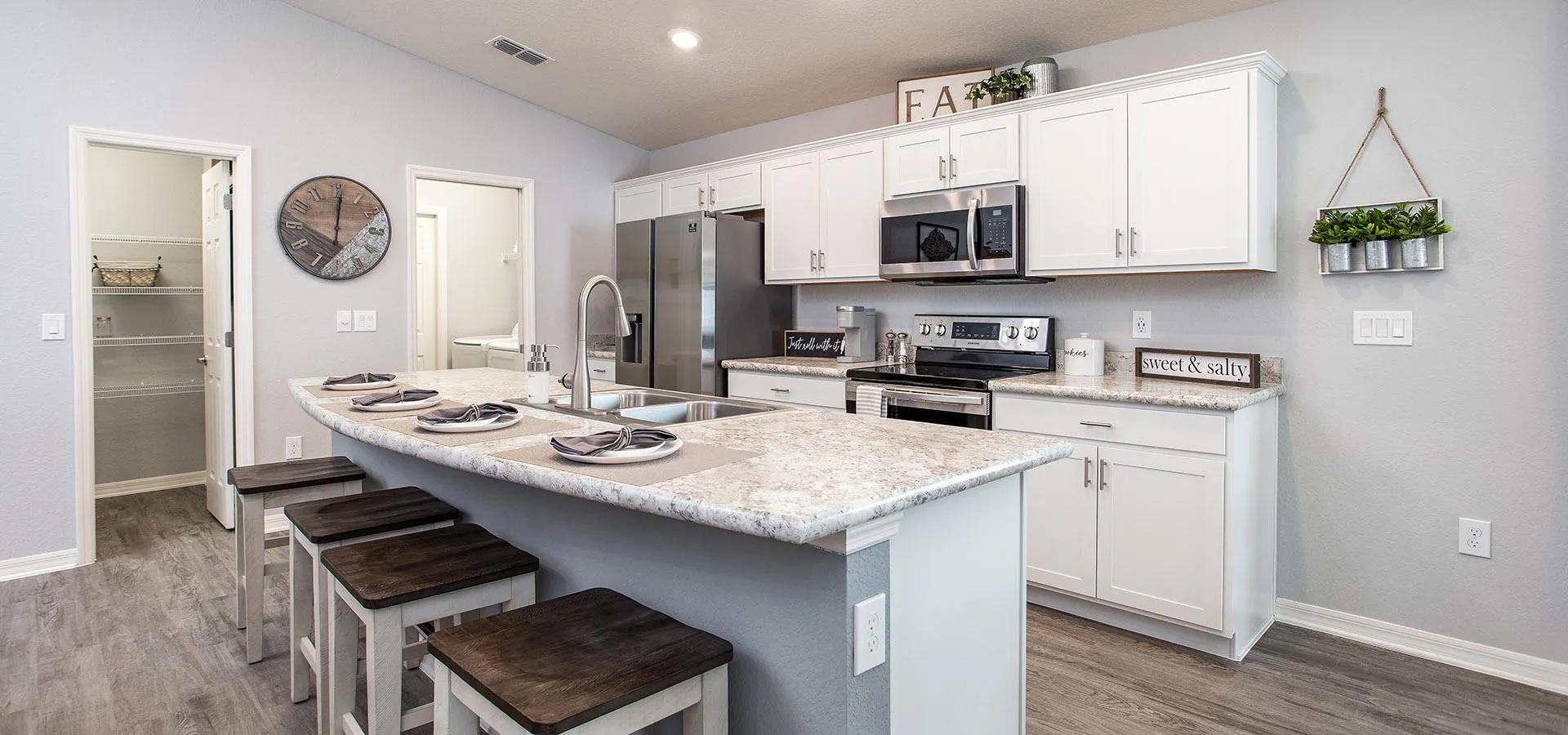 Gourmet kitchen with pantry and dedicated laundry room