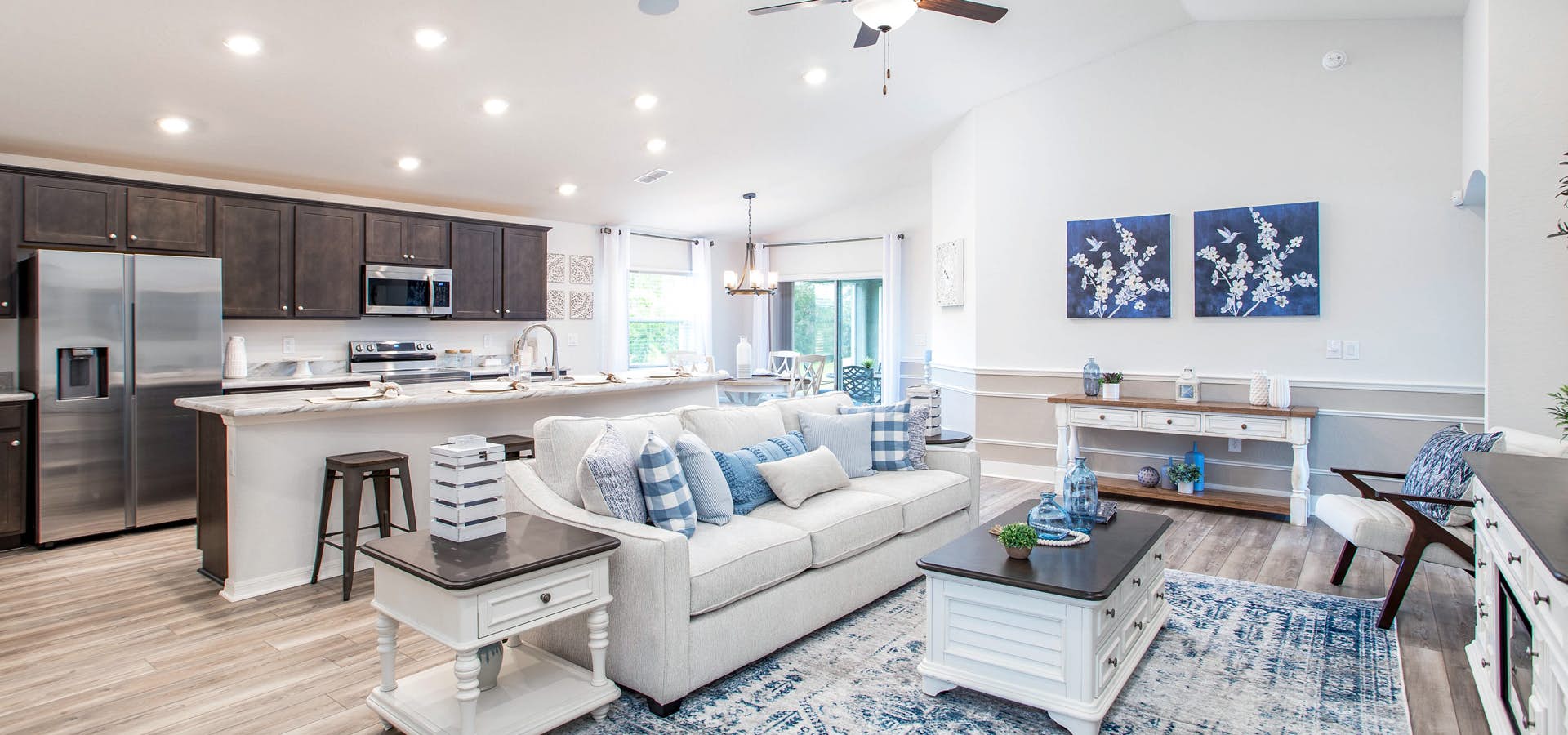 Open living area and kitchen with beachy decor