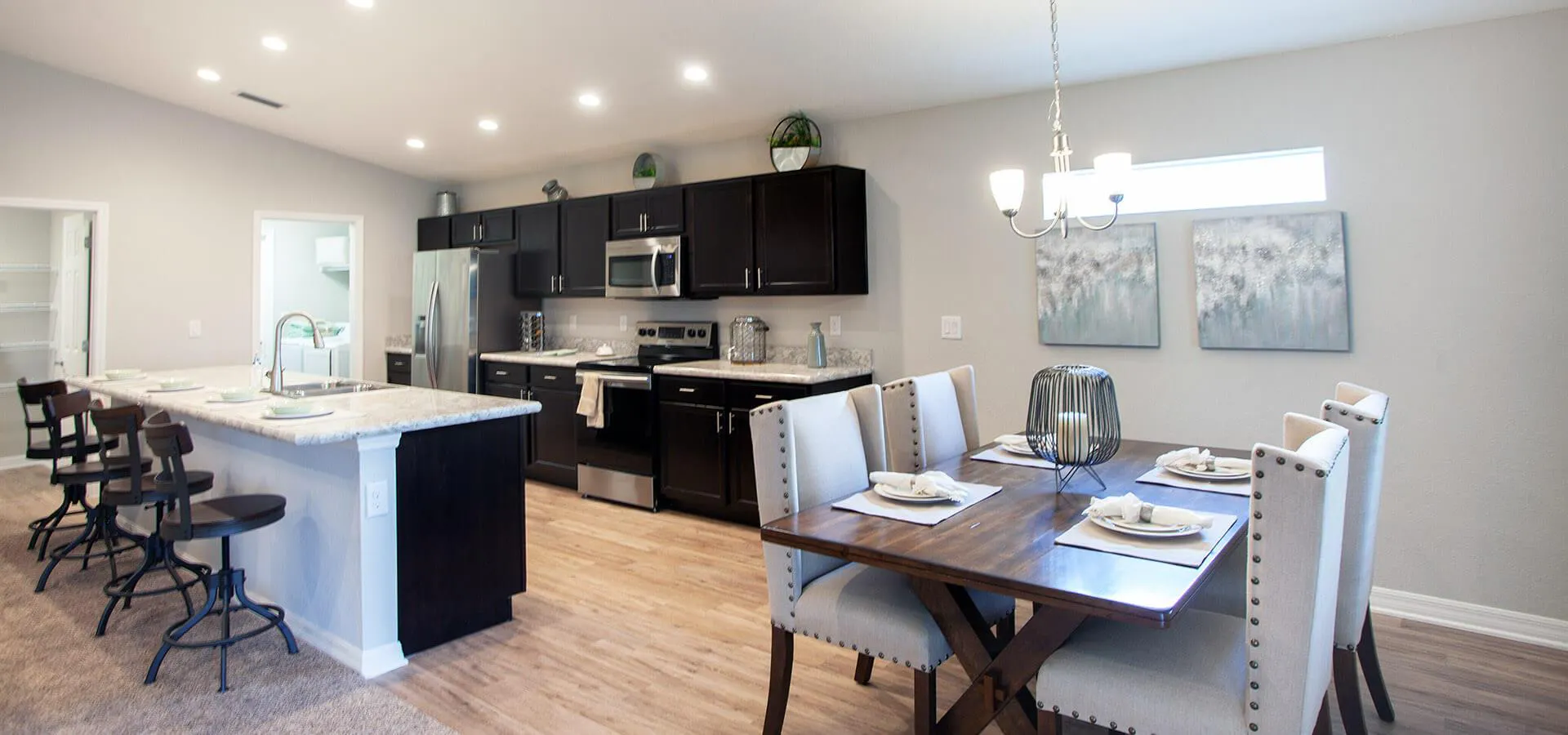 New home kitchen with breakfast bar and dining area