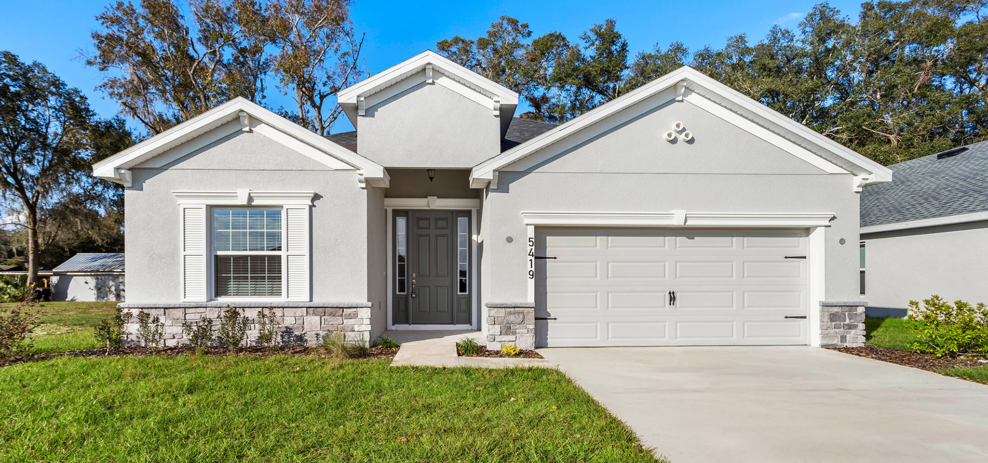 Exterior of a new home coming soon to The Collection at Palm Bay by Highland Homes