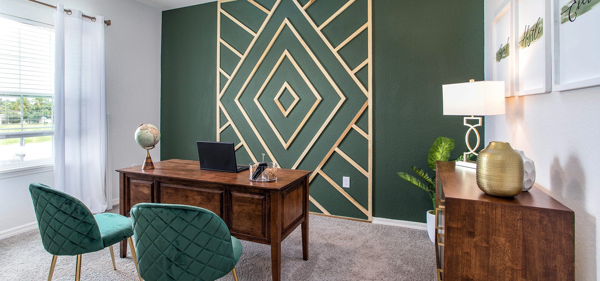 Glam home office decor with green and gold art deco accent wall