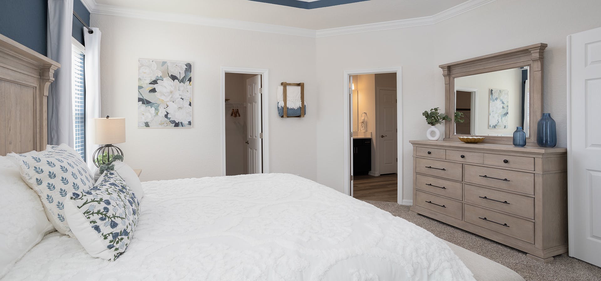 Large owner's bedroom suite in Highland Homes' St. Cloud model home