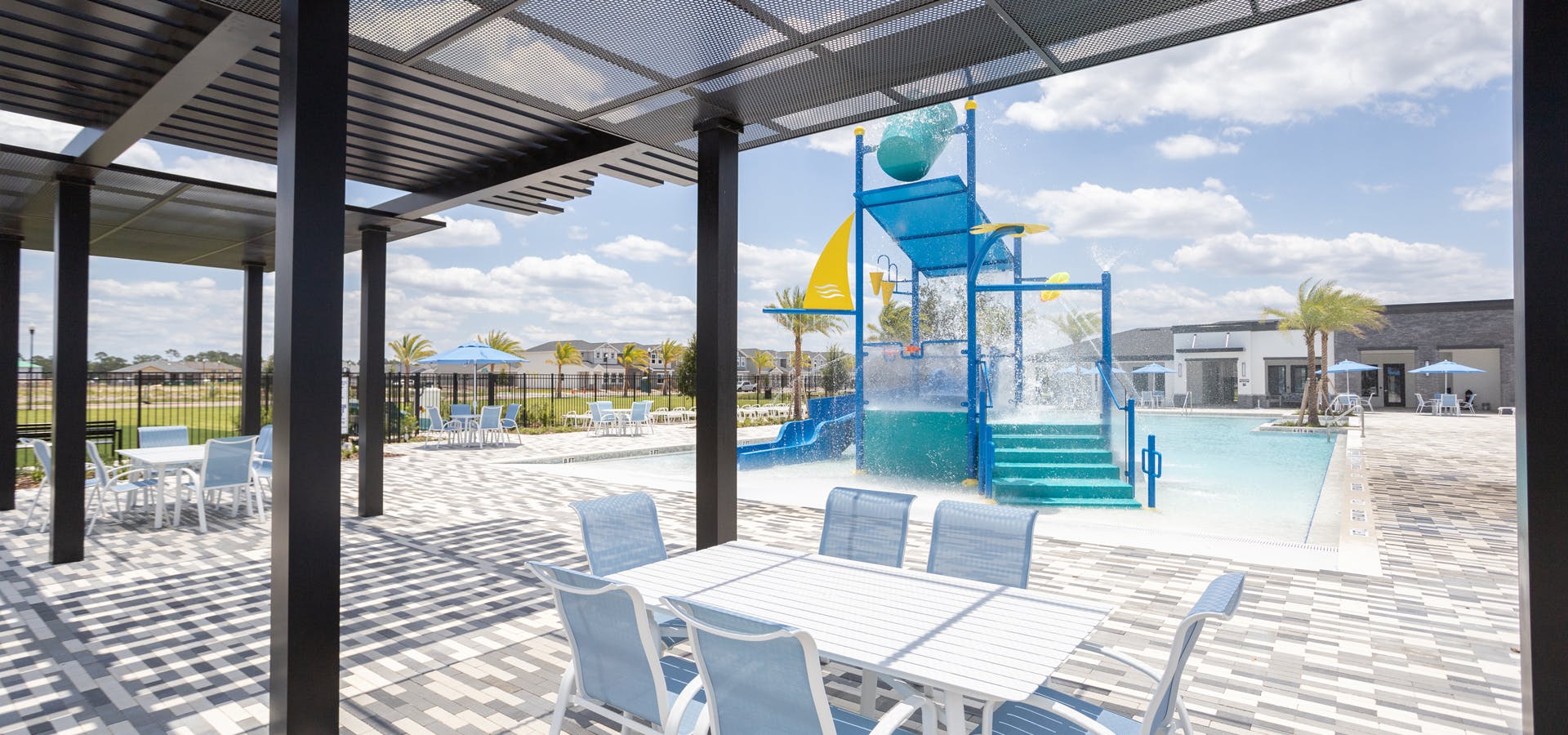 Pool and splash pad amenities at The Crossings in Saint Cloud, Florida