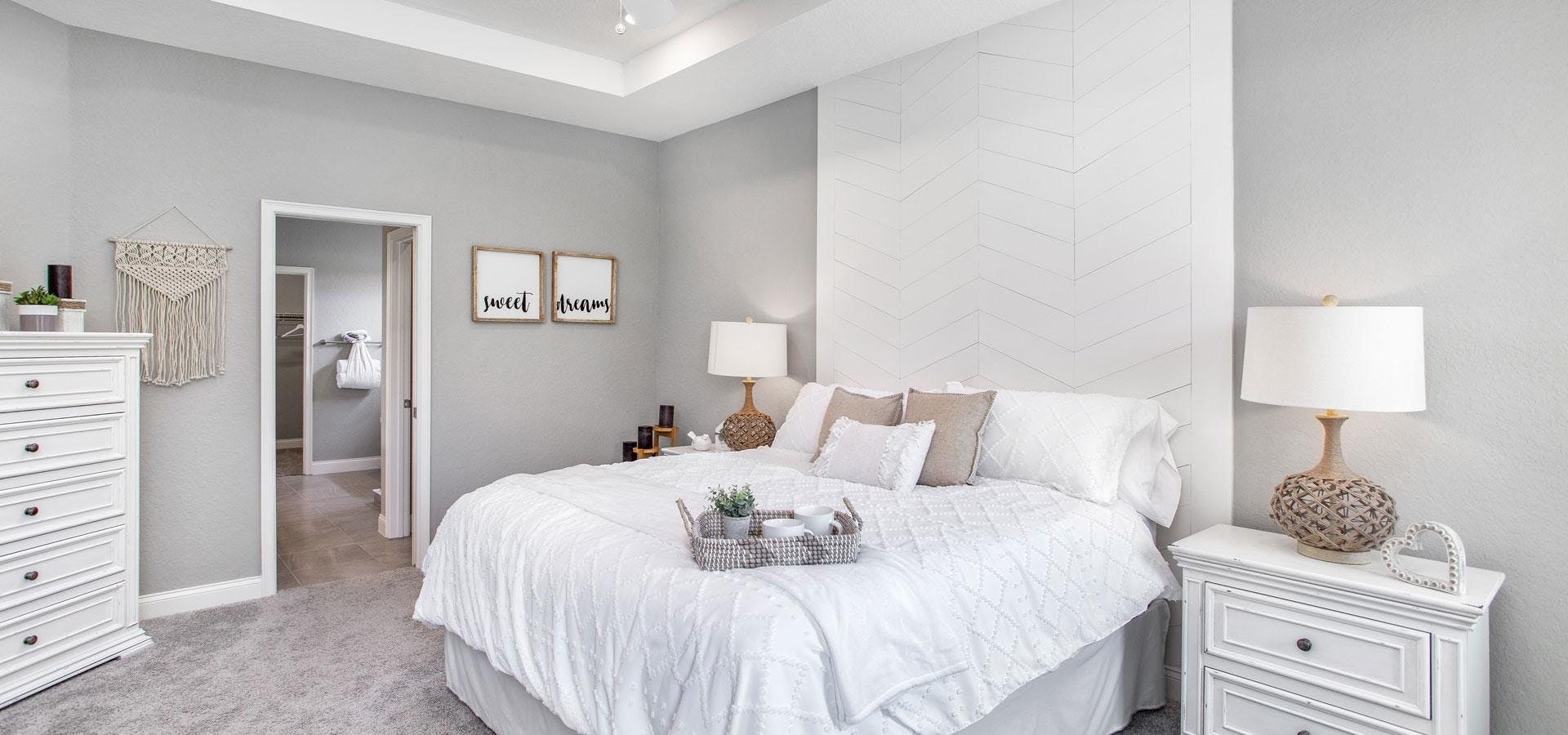 Large owner's suite with trey ceiling of Waylyn model at Treymont community