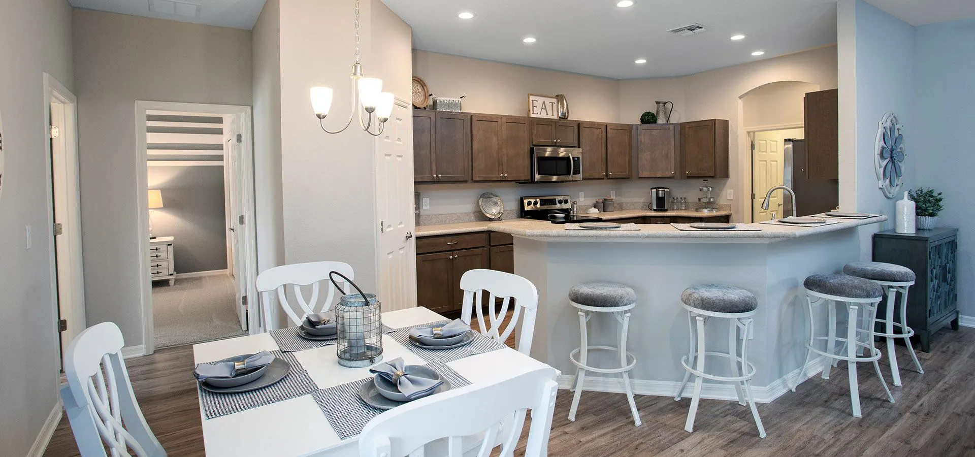 Dining cafe adjacent to kitchen with breakfast bar