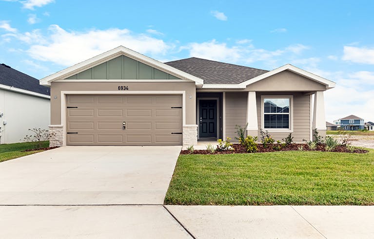 Florida new home with Craftsman-style, exterior, front porch, and 2-car garage