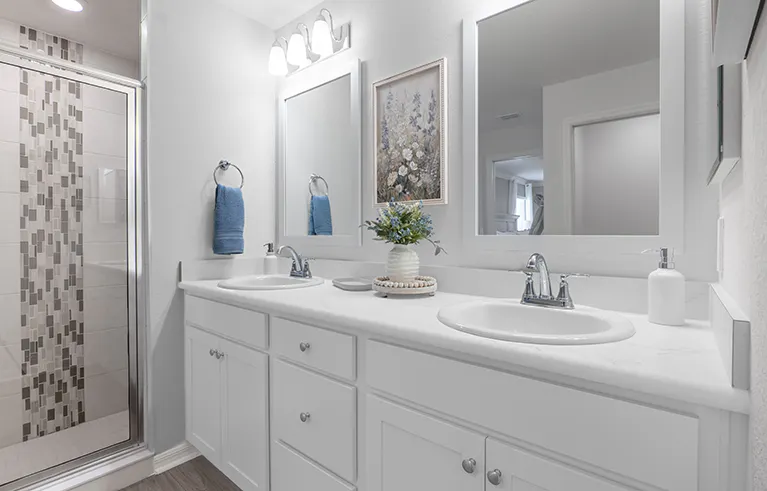 En-suite bath with waterfall tile in the shower, in the Raychel by Highland Homes in Lakeland, FL