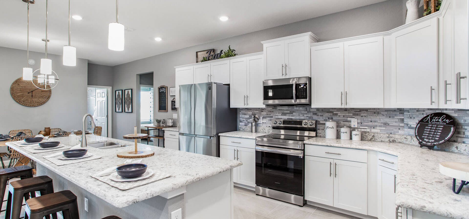 White kitchen with quartz countertops in the Waylyn by Highland Homes