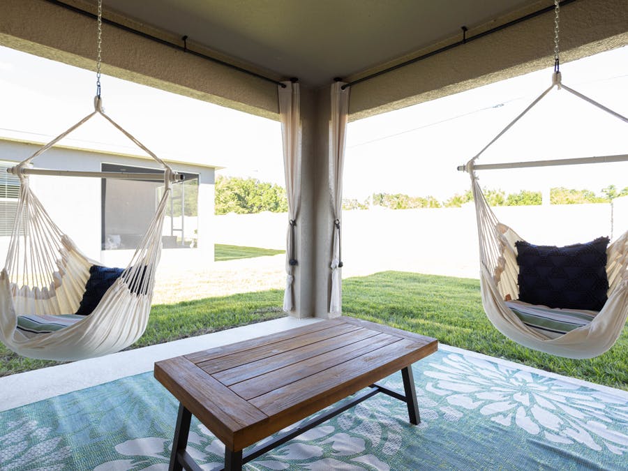 Hanging chairs provide whimsical outdoor seating