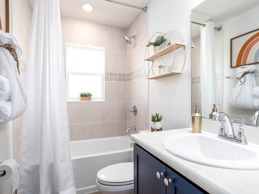 Secondary bathroom with a tub & shower combo
