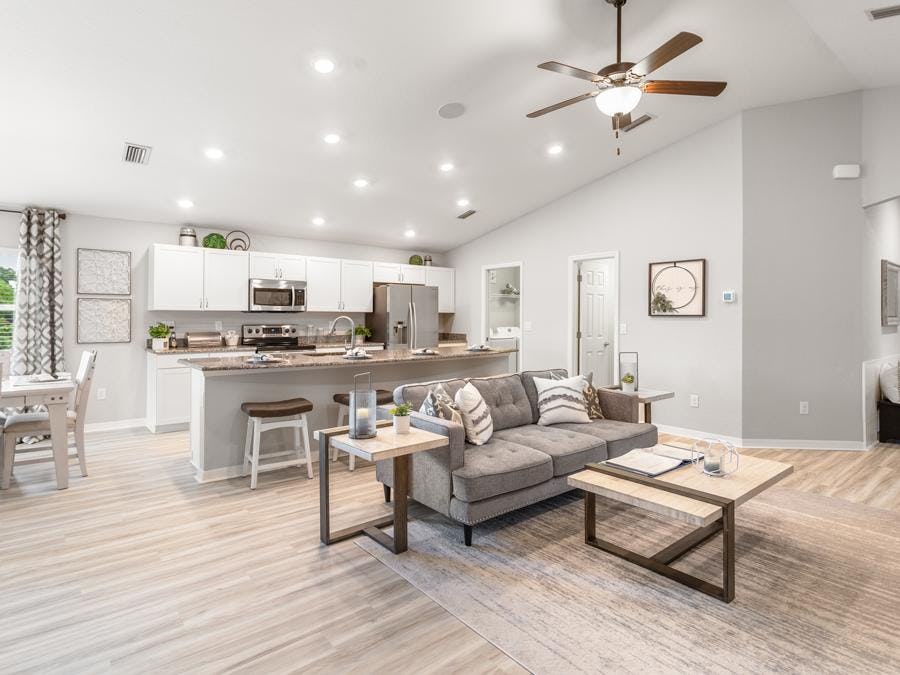 Bright and open living area in the Parker by Highland Homes in Parrish, FL