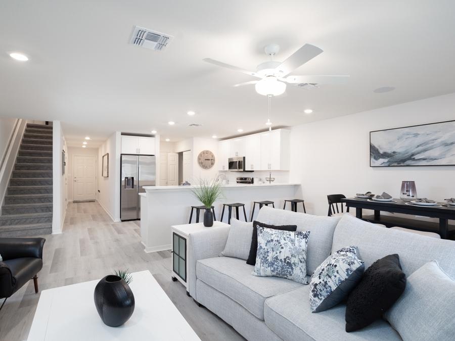 Open living area in a townhome with white and grey decor