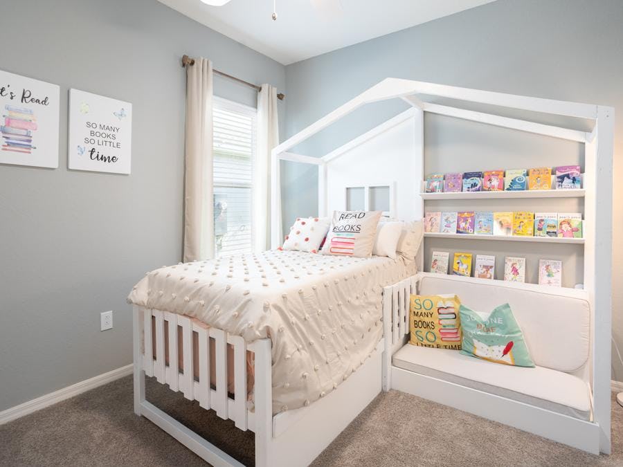 This book themed kids room incorporates a custom-made, multi-use piece of furniture to maximize the room space.