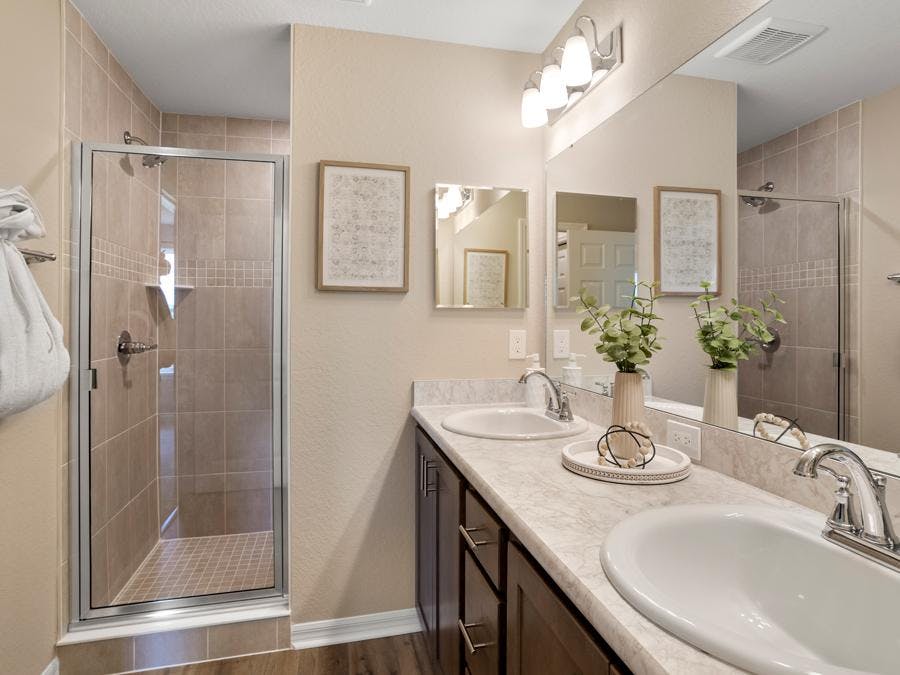 En-suite owner's bath in the Isla model home at Harbor at Lake Henry in Winter Haven, FL