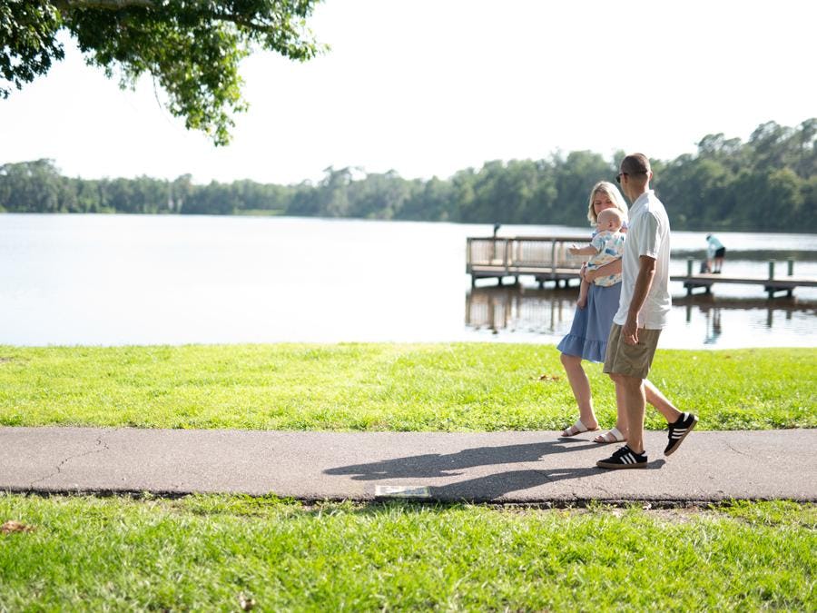 couple walking at Walden Lake Park in Plant City, FL